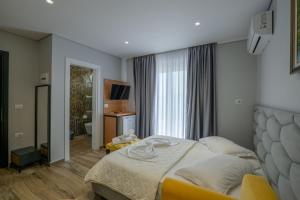 Postel nebo postele na pokoji v ubytování Sunkised Hotel