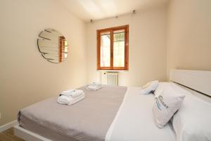 En eller flere senge i et værelse på Garden Residence Malcesine Lake View + 106 billeder