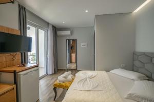 Postel nebo postele na pokoji v ubytování Sunkised Hotel