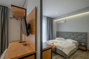 Postel nebo postele na pokoji v ubytování Sunkised Hotel