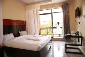 Postel nebo postele na pokoji v ubytování Sunstar Resort Thika