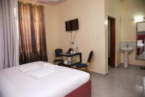 Postel nebo postele na pokoji v ubytování Sunstar Resort Thika