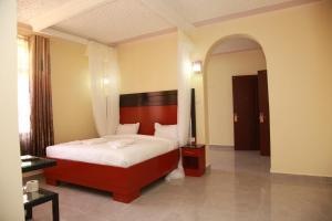 Postel nebo postele na pokoji v ubytování Sunstar Resort Thika