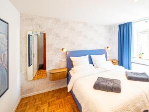 Postel nebo postele na pokoji v ubytování Apartments am Linggplatz