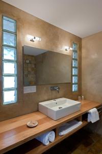 a bathroom with a sink and a mirror at H&ocirc;tel Campo Dell'oro in Ajaccio