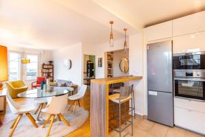 Kuchyň nebo kuchyňský kout v ubytování GuestReady - Contemporary Apt in the 20th Arr