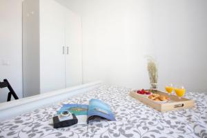 Posteľ alebo postele v izbe v ubytovaní GuestReady - Valencia's Cabanyal Confy Apartment