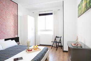 Posteľ alebo postele v izbe v ubytovaní GuestReady - Valencia's Cabanyal Confy Apartment