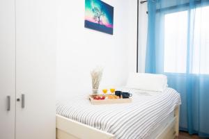 Posteľ alebo postele v izbe v ubytovaní GuestReady - Valencia's Cabanyal Confy Apartment