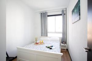 Posteľ alebo postele v izbe v ubytovaní GuestReady - Valencia's Cabanyal Confy Apartment + 19 fotografií