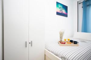 Posteľ alebo postele v izbe v ubytovaní GuestReady - Valencia's Cabanyal Confy Apartment