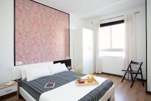 Posteľ alebo postele v izbe v ubytovaní GuestReady - Valencia's Cabanyal Confy Apartment