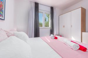 Posteľ alebo postele v izbe v ubytovaní Apartment Maggi