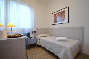 Кровать или кровати в номере Olimpia Hotel & Aparthotel