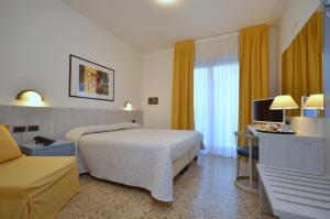 Кровать или кровати в номере Olimpia Hotel & Aparthotel