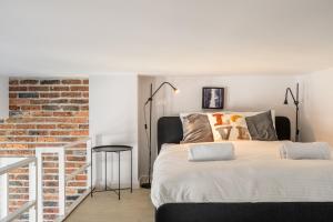 Posteľ alebo postele v izbe v ubytovaní RentPlanet - Apartament Matejki