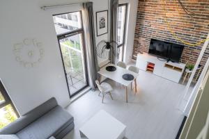 Televízia a/alebo spoločenská miestnosť v ubytovaní RentPlanet - Apartament Matejki