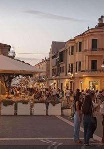 a group of people standing on a city street at MAISON del MARE TERMOLI CB in Termoli