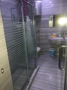 a bathroom with a shower and a toilet and a sink at Hacienda bay standalone in El Alamein