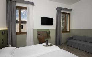 TV a/nebo společenská místnost v ubytování Hotel Casa Del Pellegrino