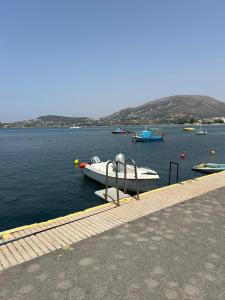 a group of boats in a body of water at Athens Palaia Fokaia Entire Flat 2 bedrooms with panoramic sea views and a massive veranda , only steps away from the beach and amenities in Palaiá Fókaia