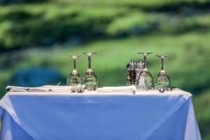a group of glass bottles sitting on top of a table at Hôtel Campo Dell'oro in Ajaccio