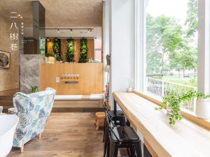 a bathroom with a large window and a sink at 28 Shu Xiang Hotel in Taichung +60 photos