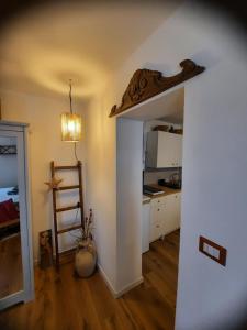 a kitchen with a stairway leading into a room at Oselyn Holiday Flat in Bucine