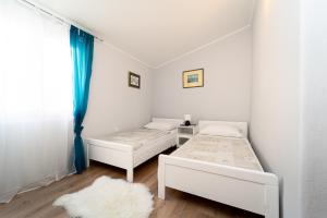 Postel nebo postele na pokoji v ubytování Holiday Home Mara