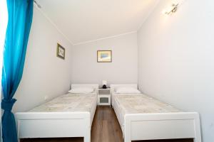 Postel nebo postele na pokoji v ubytování Holiday Home Mara