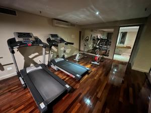 an overhead view of a gym with treadmill and ellipticals at Kenton Palace Buenos Aires in Buenos Aires