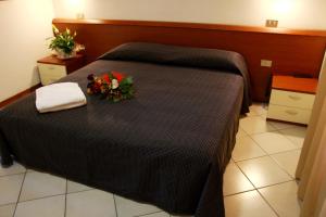 Postel nebo postele na pokoji v ubytování Hotel Excelsior