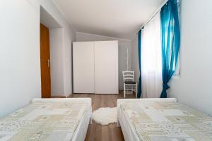 Postel nebo postele na pokoji v ubytování Holiday Home Mara