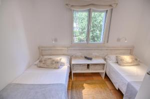Postel nebo postele na pokoji v ubytování Refurbished Apartment Seaview, Santa Agata