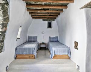 Postel nebo postele na pokoji v ubytování Tinoshomelidays Residences