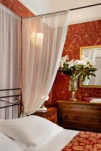 Postel nebo postele na pokoji v ubytování Hotel Palazzo dal Borgo