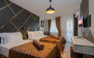 TV a/nebo společenská místnost v ubytování Monart City Hotel - All Inclusive Plus