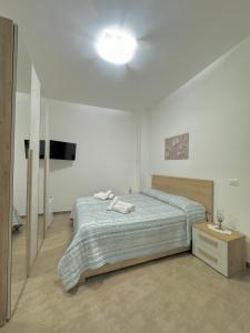 Postel nebo postele na pokoji v ubytování La Perla a Marzamemi