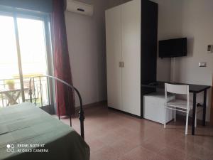 TV a/nebo společenská místnost v ubytování Nemi rooms