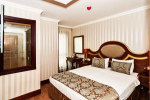 A bed or beds in a room at The Central Hotel