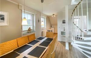 a living room with a table and some windows at Meeresbrise in Gollwitz +29 photos
