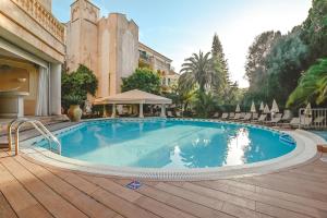 The swimming pool at or close to Lago Garden Apart-Suites & Spa Hotel