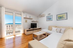 TV a/nebo společenská místnost v ubytování Apartments Gisela