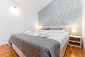 Postel nebo postele na pokoji v ubytování Apartments Gisela
