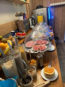 a table with food and drinks on a counter at Logis Hôtel Château De Palaja in Carcassonne