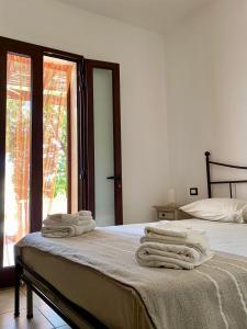 Postel nebo postele na pokoji v ubytování Villa Elia - Tenuta Le Scerze - Salento Homes