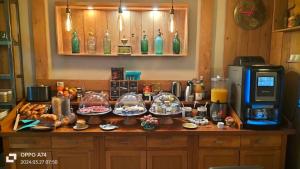 a kitchen with a counter with food on it at Logis Hôtel Château De Palaja in Carcassonne +261 photos