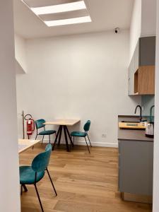a kitchen with a table and chairs in a room at Dimora Donna Maria Relais in Cava deʼ Tirreni