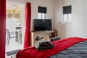 TV a/nebo společenská místnost v ubytování Dushi Vida Country Inn