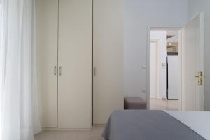 Postel nebo postele na pokoji v ubytování Almia Suite
